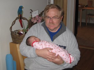 My dad holding Shannon when she was about 2 weeks old